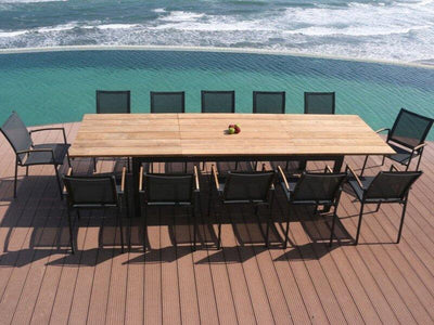 Marzelle Outdoor Extendable Teak Dining Table by the pool with sleek black chairs, showcasing elegant design and sustainability.