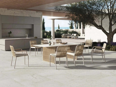 Maui Outdoor Dining Chair in modern outdoor setting with tubular aluminum frame and woven polyester ropes.