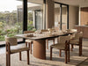 Mawson Twin Extendable Dining Table with a pale stone-patterned top, dark edging, and warm walnut-toned pedestal base.