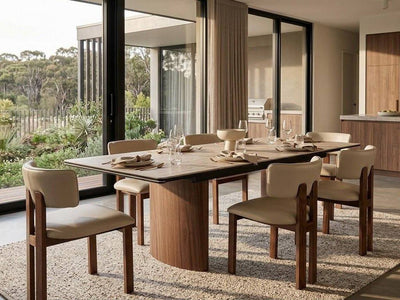 Mawson Twin Extendable Dining Table with a pale stone-patterned top, dark edging, and warm walnut-toned pedestal base.