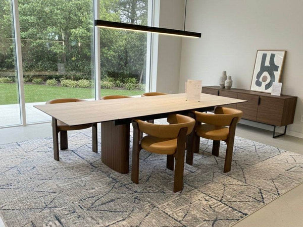 Miles Leather Dining Chair in vintage tan leather with walnut stained rubber wood legs and modern barrel design