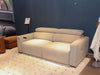Metro 3 Seater Sofa Bed in beige fabric, displayed in a modern living room setting.
