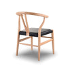 Mia Dining Chair with polished rubberwood frame and black leather seat, combining classic design and modern comfort.