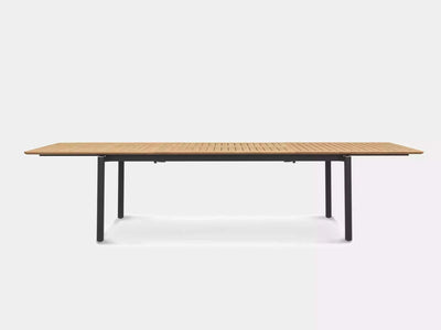 Milan Outdoor Teak Extendable Dining Table with stainless steel frame, shown fully extended.
