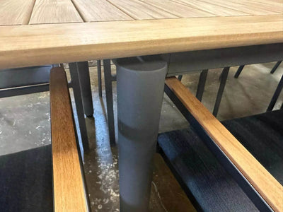 Milan Outdoor Teak Extendable Dining Table with natural teak finish and stainless steel frame.