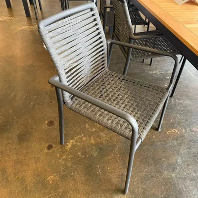 Napoli Outdoor Rope Chair with charcoal frame and slate rope detail in a modern setting.