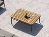 Nine Degrees Outdoor Coffee Table with synthetic teak top and aluminum frame, ideal for garden or patio.