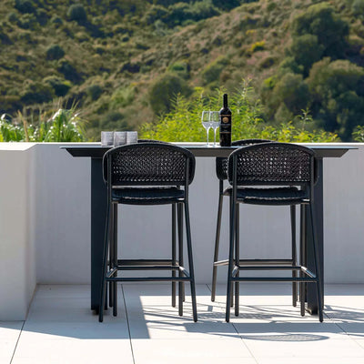 Butterfly Outdoor Bar Chair in sophisticated design setup with all-weather aluminum frame and Italian polyethylene rope weaving.