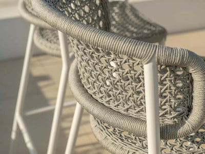 Butterfly Outdoor Bar Chair with intricate woven backrest and aluminum frame.