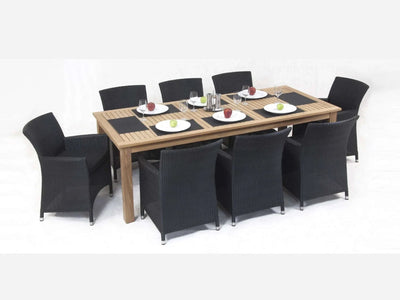 Caribbean Outdoor Dining Chair made of powder-coated aluminum and handwoven synthetic rattan, set around a wooden table.