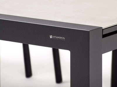 Livorno Outdoor Ceramic Extendable Dining Table detail with charcoal frame and light marble top.