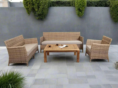 Caribbean 6 Seater Outdoor Lounge Set with synthetic rattan and Sunbrella cushions displayed on a patio.