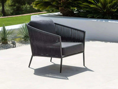 Jiselle Outdoor Lounge - 1 Seater Rope Sofa on patio, featuring Italian rope weaving and Sunbrella cushions.
