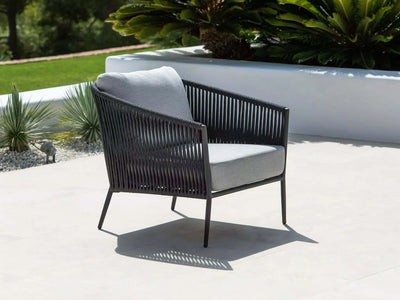 Jiselle Outdoor Lounge 1-Seater Rope Sofa with Sunbrella Cushions on a patio.
