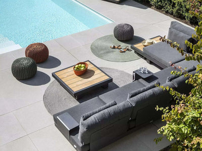 Bari Light Outdoor Lounge 3 Seater Sofa by the pool with charcoal Sunbrella cushions and modular setup.