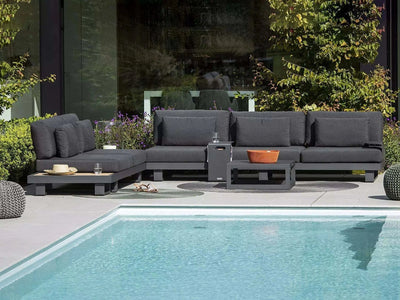 Bari Light Outdoor Lounge 1 Seater near pool with charcoal aluminum frame and Sunbrella cushions.