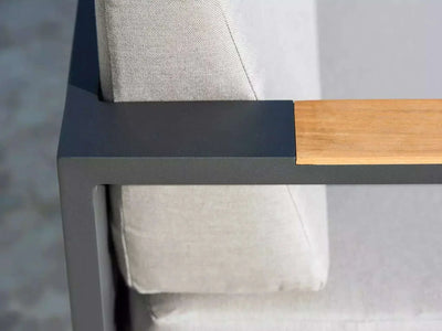 Belvedere Outdoor Lounge - close-up of armrest with teak trim and Sunbrella cushions.