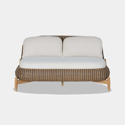 Cloud Outdoor Lounge - 2 Seater Outdoor Sofa with woven rattan and teak legs.