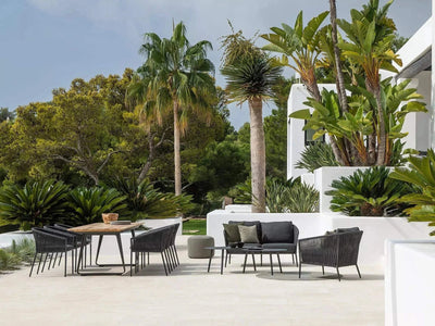 Jiselle Outdoor Lounge 1 Seater Rope Sofa in stylish garden setting.