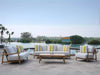 Corsica Outdoor Lounge 1 Seater Outdoor Sofa by poolside with teak frame and Sunbrella cushions.