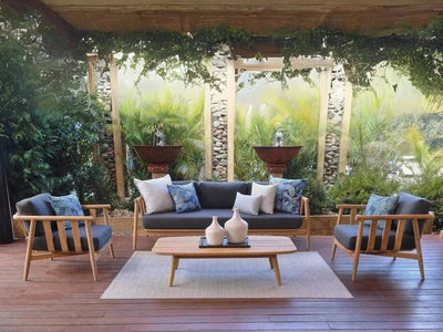 Finley Outdoor Lounge - 1 Seater Sofa in teak with Sunbrella cushions on patio.