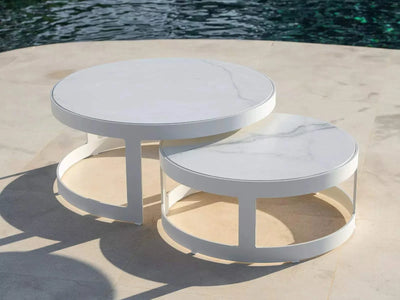 Adagio Outdoor Round Coffee Tables set of 2 with ceramic finishes by a pool.