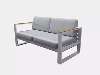 Belvedere Outdoor Lounge - 2 Seater Sofa with aluminum frame, teak arm trims, and Sunbrella cushions.