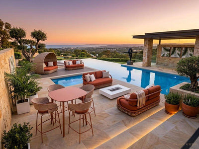 Palma outdoor bar table and chairs with Canasta outdoor sofas in a poolside setting