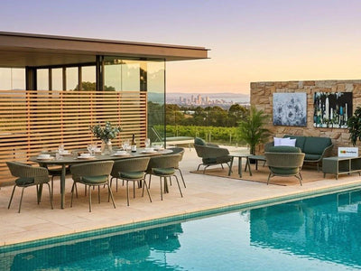 Palma outdoor dining set and sofa set in a contemporary poolside entertaining area
