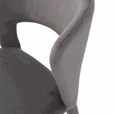 Close-up of Pari Fabric Dining Chair in Regis Smoke showing fully upholstered ergonomic design and smooth fabric texture