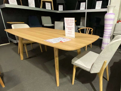 Pavella wooden dining table set with six Raya fabric chairs on clearance sale
