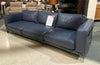 Perry 3.75 seater navy blue leather sofa by Domicil on clearance sale price tag displayed