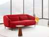 Poppy 2.5 Seater Sofa in vibrant red fabric with modern design, situated in a bright living space.