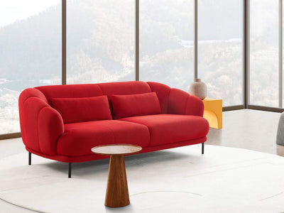 Poppy 2.5 Seater Sofa in vibrant red fabric with modern design, situated in a bright living space.