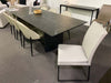 President black ceramic dining table with eight Rimini chairs in Black November Sale at Taste Furniture Adelaide