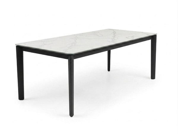 Rivoli Dining Table with black powder-coated steel base and Spanish ceramic top