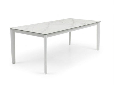 Rivoli Dining Table with powder-coated steel base and Spanish ceramic top