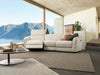 Royale 3 Seater Curved Recliner Sofa in living room, featuring elegant curved design and white upholstery.