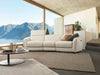Royale 3 Seater Curved Recliner Sofa in modern living room with mountain view.