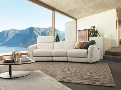 Royale 3 Seater Curved Recliner Sofa in modern living room with mountain view.