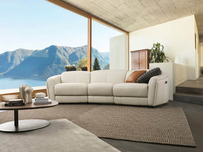 Royale 3 Seater Curved Recliner Sofa in modern living room setting with scenic view.