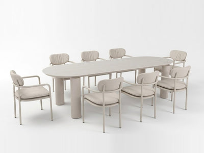 Scotland Outdoor Ceramic Table with a sand-coloured powder-coated aluminium frame and travertine ceramic top, paired with matching armchairs.