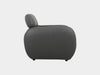 Sequence Leather Armchair, side view, sleek dark leather design.