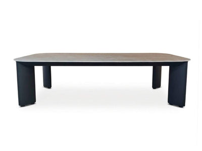 Sierra Outdoor Ceramic Coffee Table with a charcoal aluminum frame and brown wood-look ceramic top, rounded edges