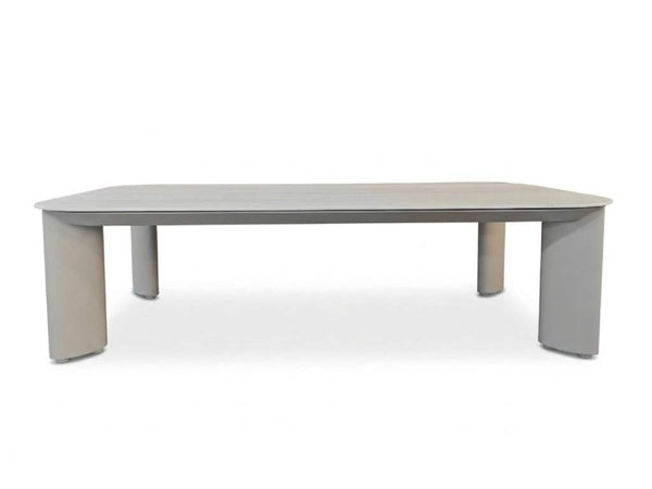 Sierra Outdoor Ceramic Coffee Table with a sand-coloured aluminum frame and pale travertine ceramic top, four legs