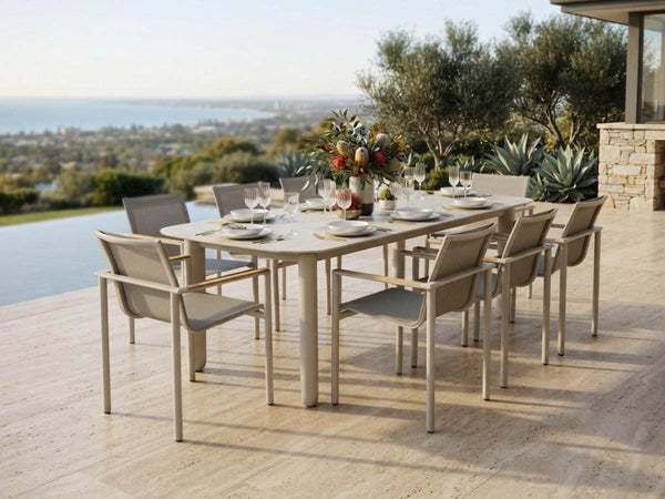 Sierra outdoor ceramic dining table in Sand with travertine ceramic top and matching dining chairs