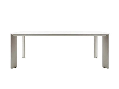 Sierra Outdoor Ceramic Dining Table with a smooth travertine-coloured 6mm ceramic top and sand-coloured frame legs