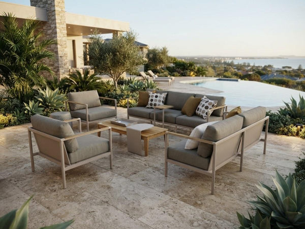Sierra Outdoor Lounge 2 Seater Sofa with aluminum frame, teak arm trim, and quick-dry cushions on patio