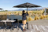 SU2 Café & Resort Outdoor Umbrella with black canopy shading outdoor dining area by lakeside
