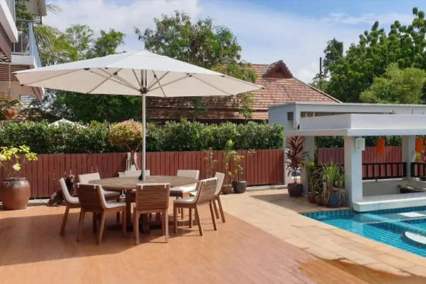 SU2 Café & Resort Outdoor Umbrella providing shade over outdoor dining set by pool in sunny patio setting